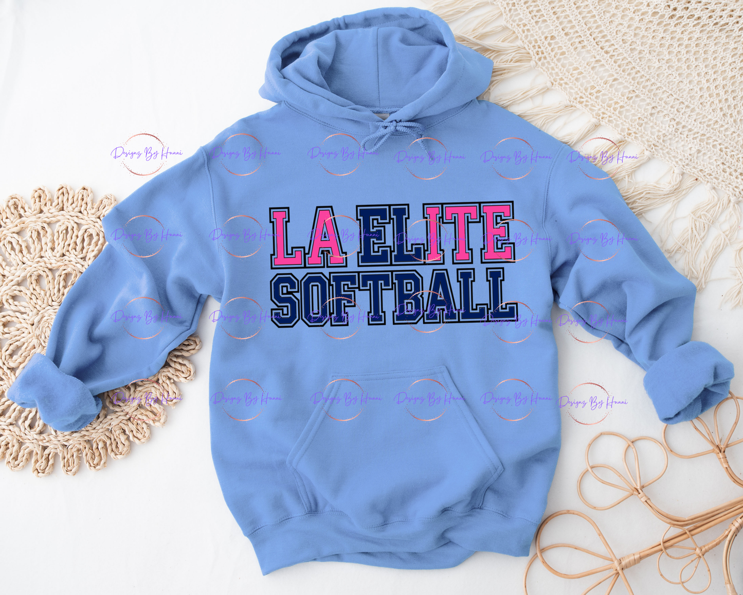 Blue hoodie with 'LA Elite Softball' text on a textured surface